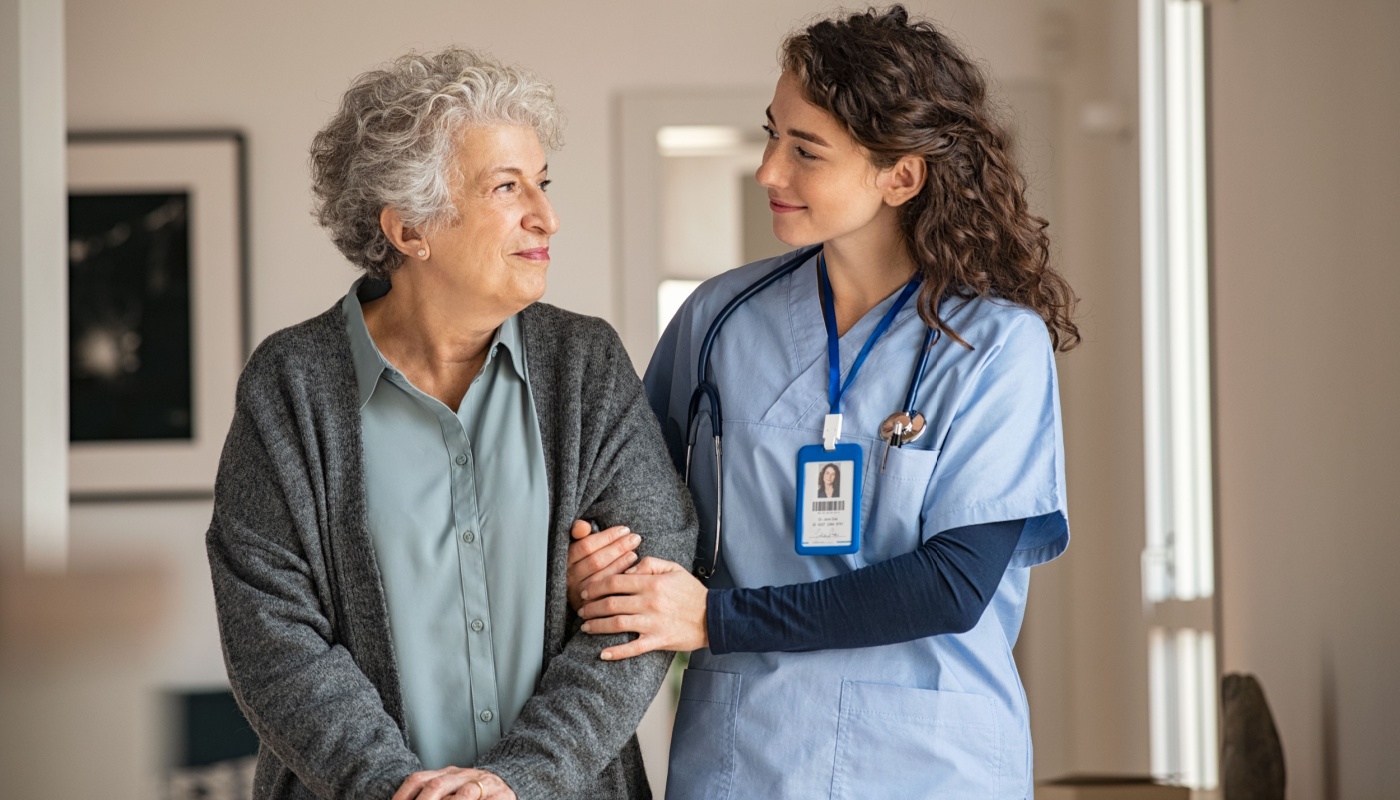 ANJ421 THREE Caregiver helping senior woman walk; patient safety concept